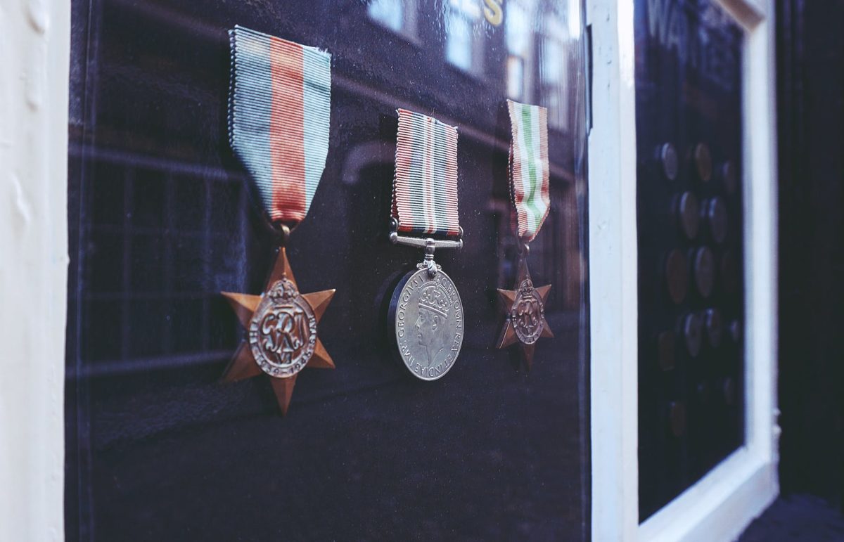 three medals in glass enclosure